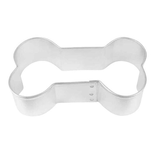 Metallic bone-shaped cookie cutter on a white background