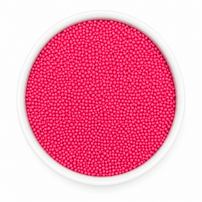 White container filled with bright pink beads on a white background